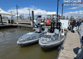 BlackSea Technologies' Chaser USVs with a 30mm autocannon and dummy missiles docked at the Air Space Sea 2026 expo. (Francis Kapper / Daily Caller News Foundation)