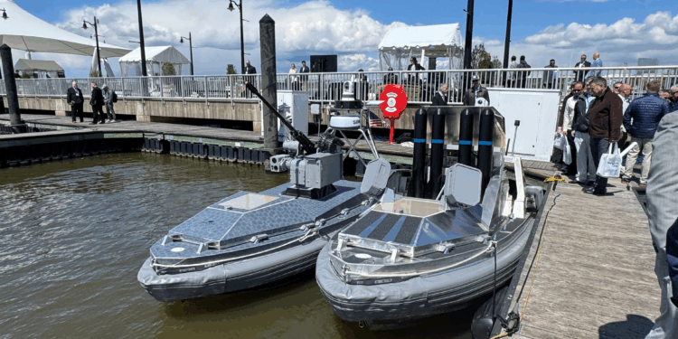 BlackSea Technologies' Chaser USVs with a 30mm autocannon and dummy missiles docked at the Air Space Sea 2026 expo. (Francis Kapper / Daily Caller News Foundation)